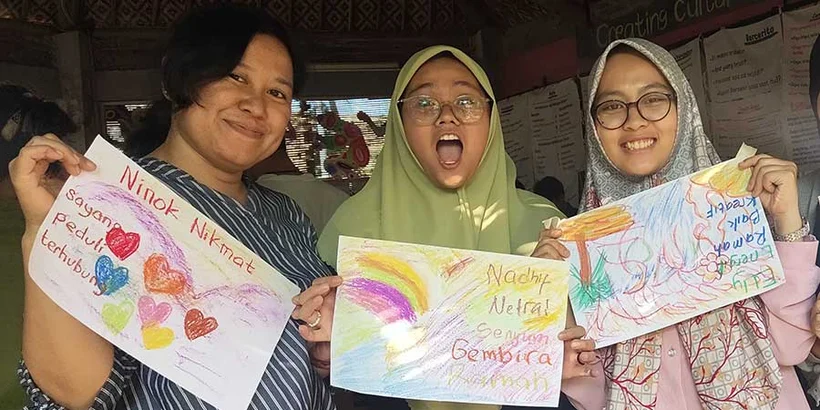 Nadif (center) poses with her Coreself photo alongside Ninok and Mellia during training at Peace Place Pati. Taken by Nanik
