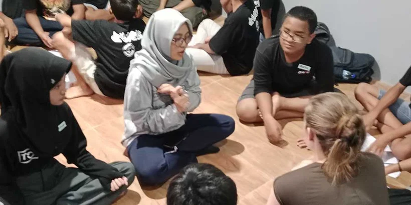 Bayu, Mellia and Emma on the Power of Goodness with adolescents at Winong. Photo:Petrus