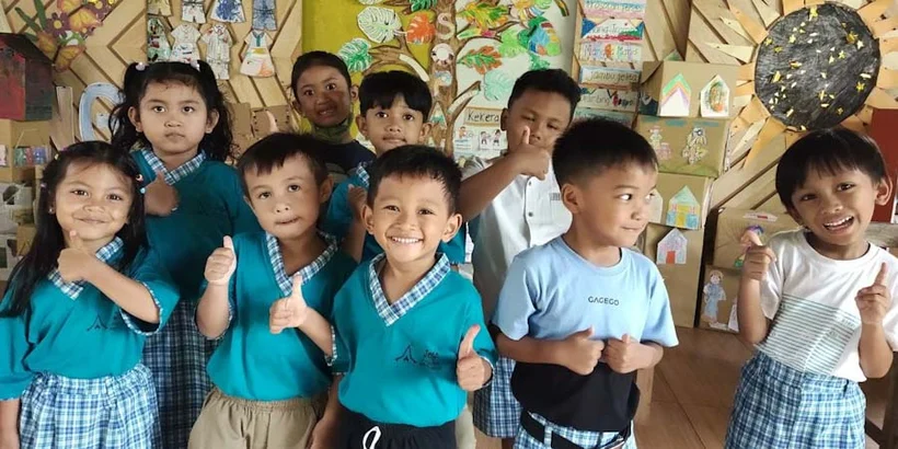 Kids pose for a group photo